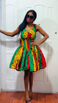 Woman wearing a colorful dress with a white door in the background